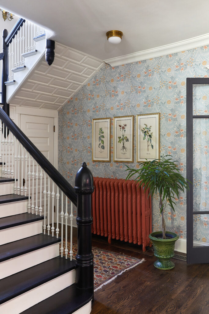The beautifully renovated staircase in Meghan Jay's 1890 Queen Anne Victorian family home.